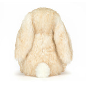 white blush tinted plush toy bunny on white background