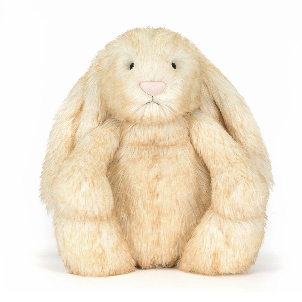 plush bunny with white blush tinted fur on white background