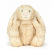 plush bunny with white blush tinted fur on white background