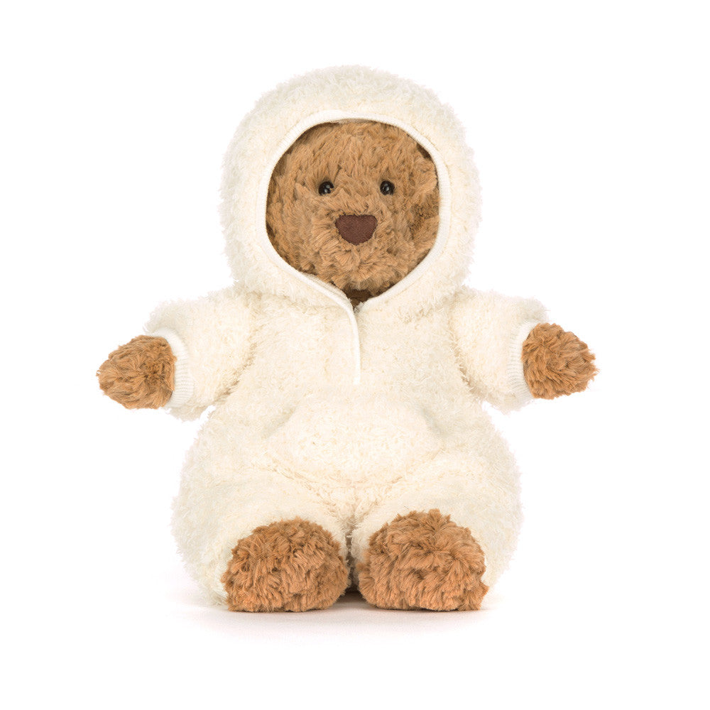plush brown bear in white hooded outfit on white background