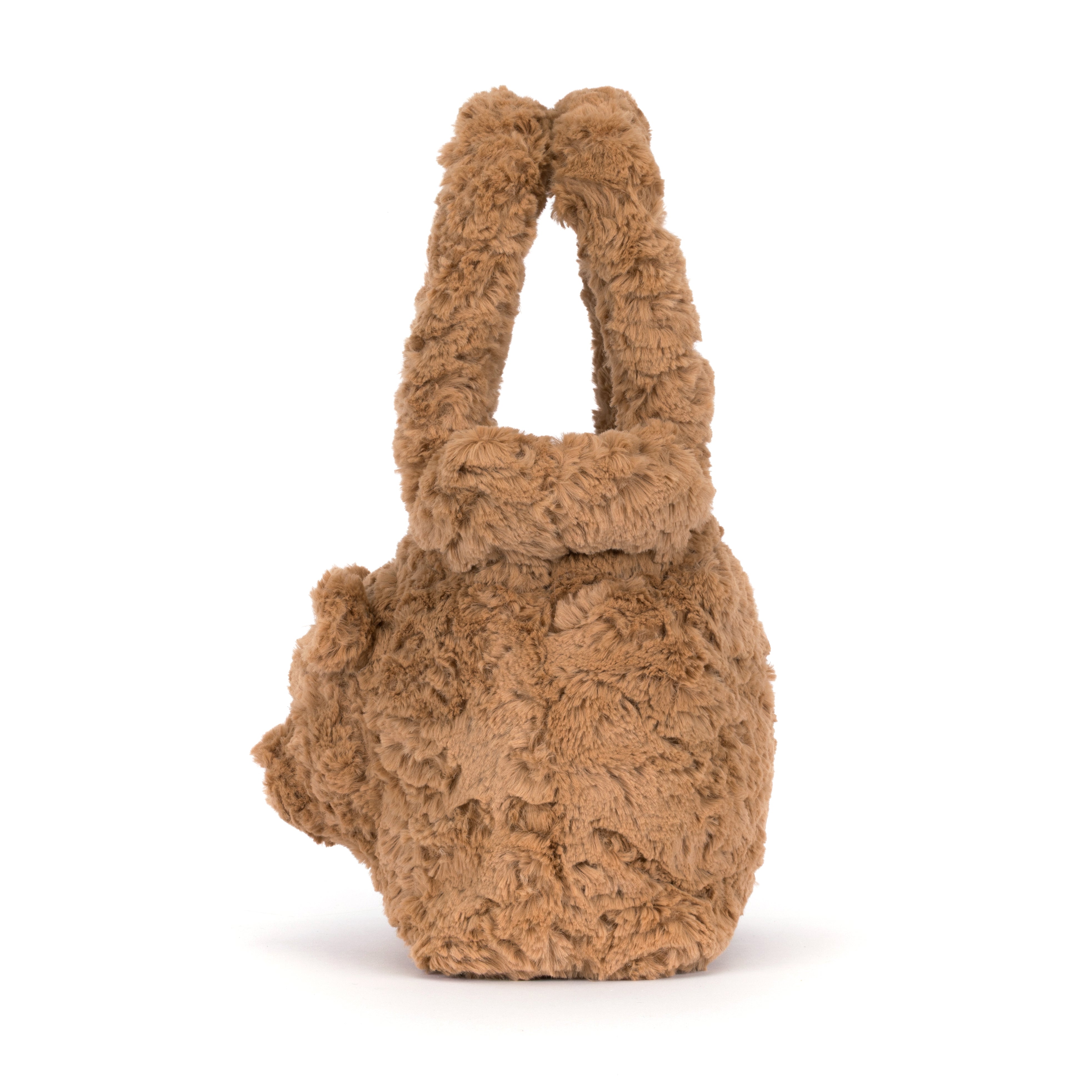 A small plush teddy bear handbag in a warm camel brown color, featuring a soft, textured fur-like body and matching handle, photographed on a clean white background.