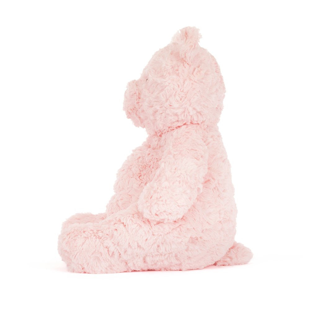 side view of Pink Jellycat teddy bear on a white background