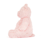 side view of Pink Jellycat teddy bear on a white background