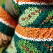 close up of Jellycat Bartholomew Bear in hiking outfit with leaf sweater
