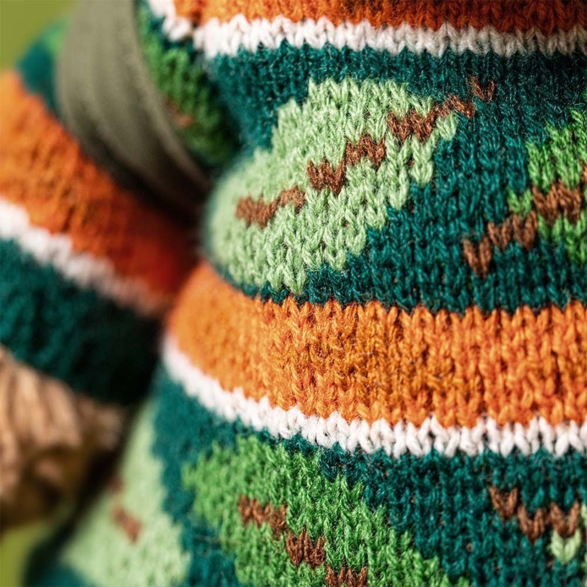 close up of Jellycat Bartholomew Bear in hiking outfit with leaf sweater
