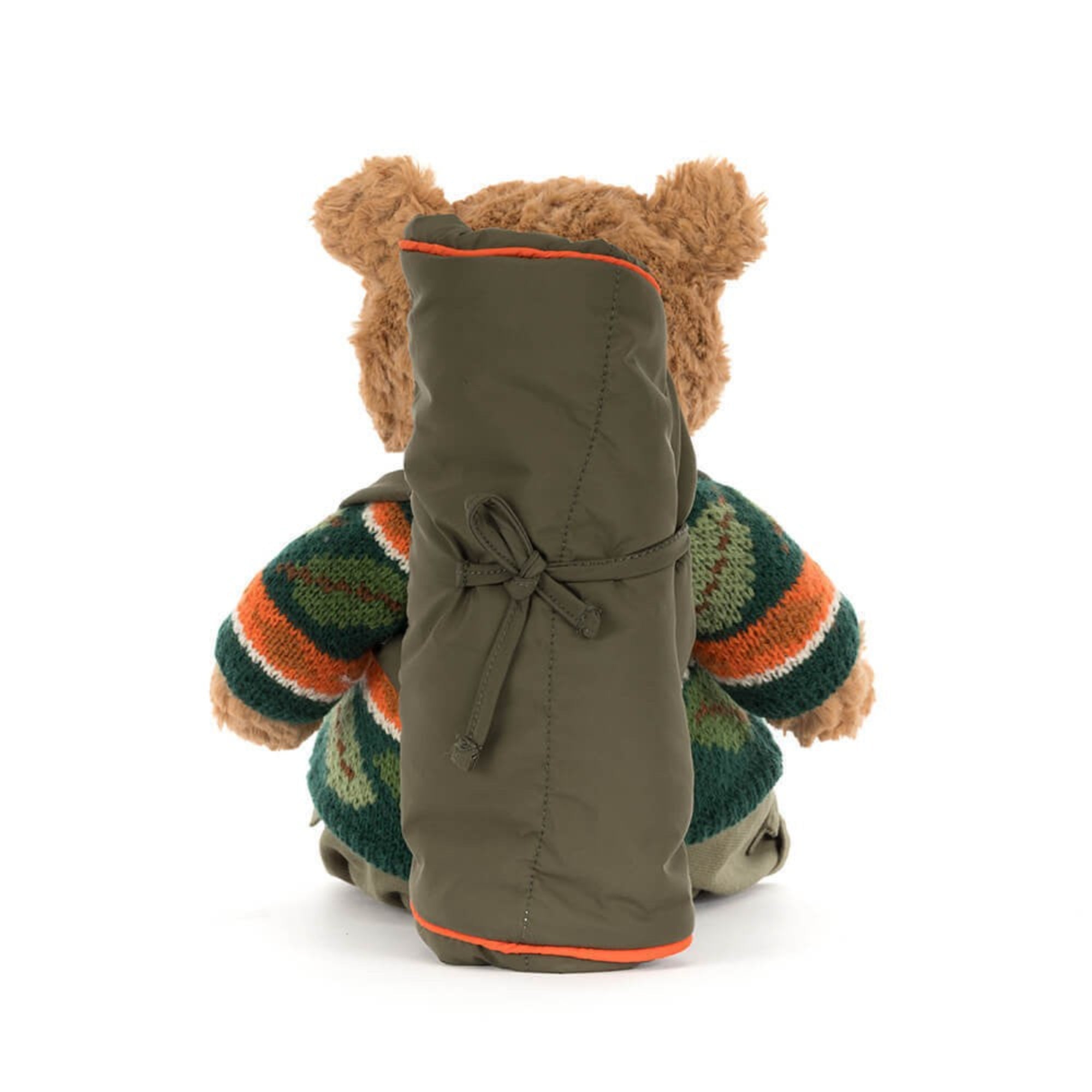 back view of Jellycat Bartholomew Bear in hiking outfit with leaf sweater and sleeping bag accessory on white background
