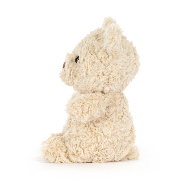 small beige plush bear on white background