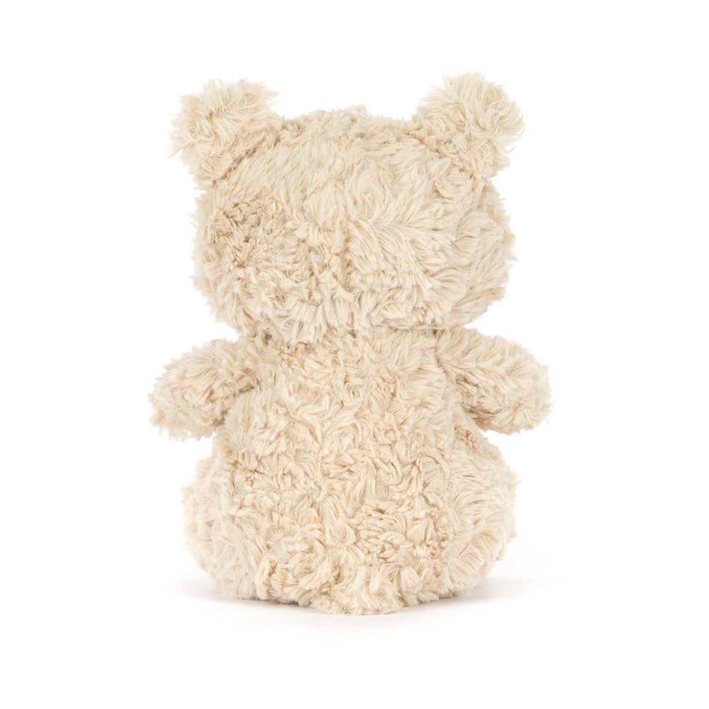 small beige plush bear on white background