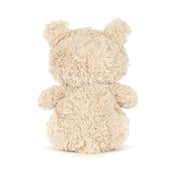 small beige plush bear on white background