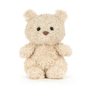 small beige plush bear on white background