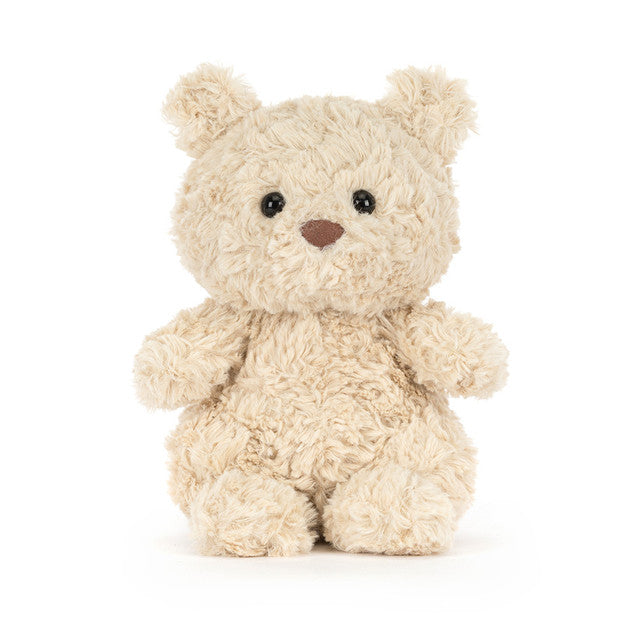small beige plush bear on white background