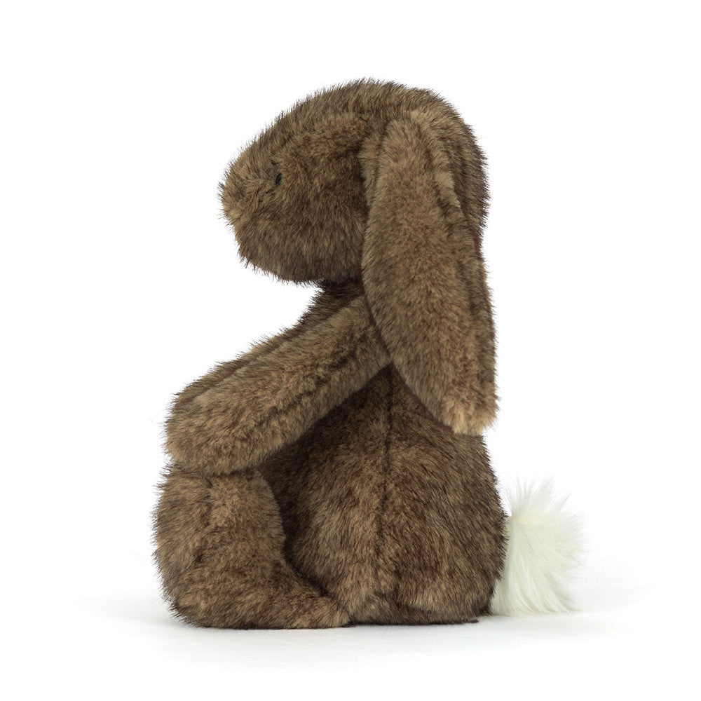 Brown plush bunny toy on a white background