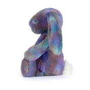 side view of plush toy bunny with purple galaxy style colouring with long ears and on a white background