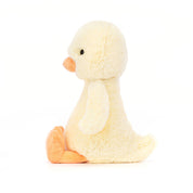 sideview of a Plush jellycat duck on a white background
