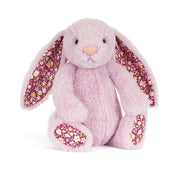 Pink plush bunny with floral ears and feet on a white background
