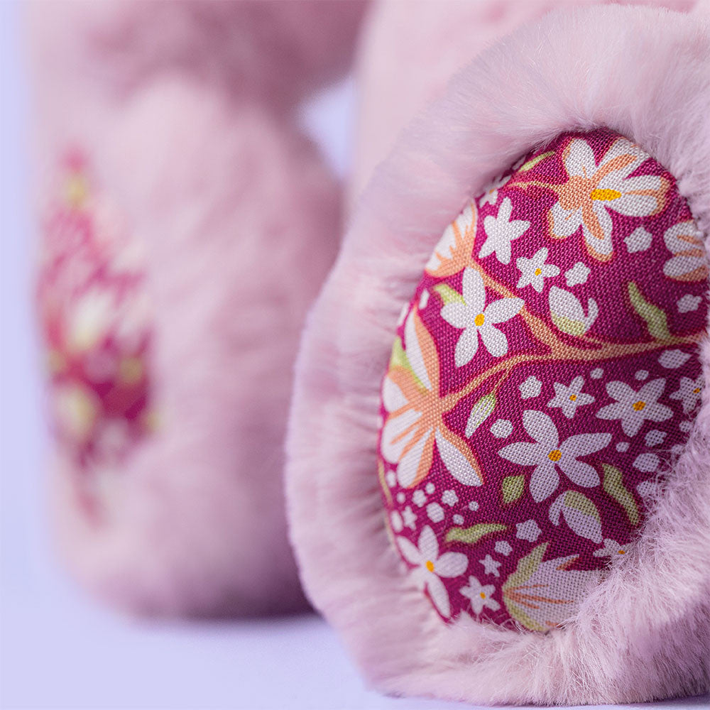 close up of pink bunny with floral pattern on feet