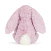 Pink plush bunny toy on a white background