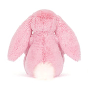 Pink plush bunny toy on a white background