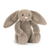 Plush grey bunny rabbit toy with long ears on a white background