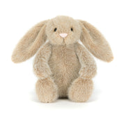 Plush beige bunny rabbit toy on a white background
