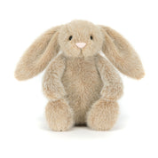 Plush beige bunny rabbit toy on a white background