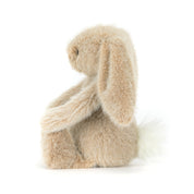 Plush beige bunny rabbit toy on a white background