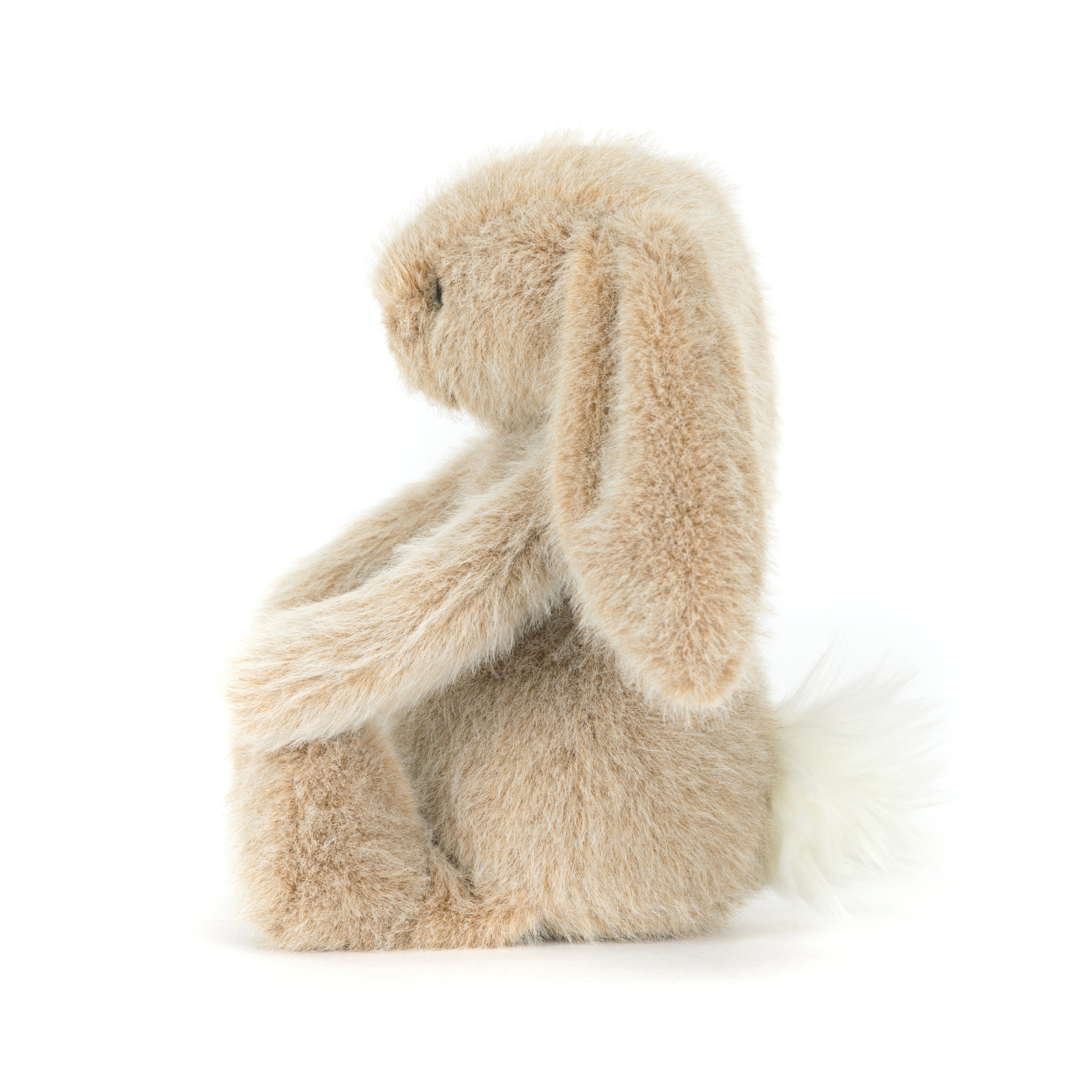 Plush beige bunny rabbit toy on a white background
