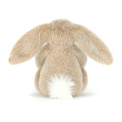 Stuffed beige bunny rabbit toy with long ears and fluffy white tail on a white background