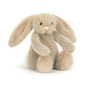 Plush beige bunny rabbit  toy with long ears on a white background