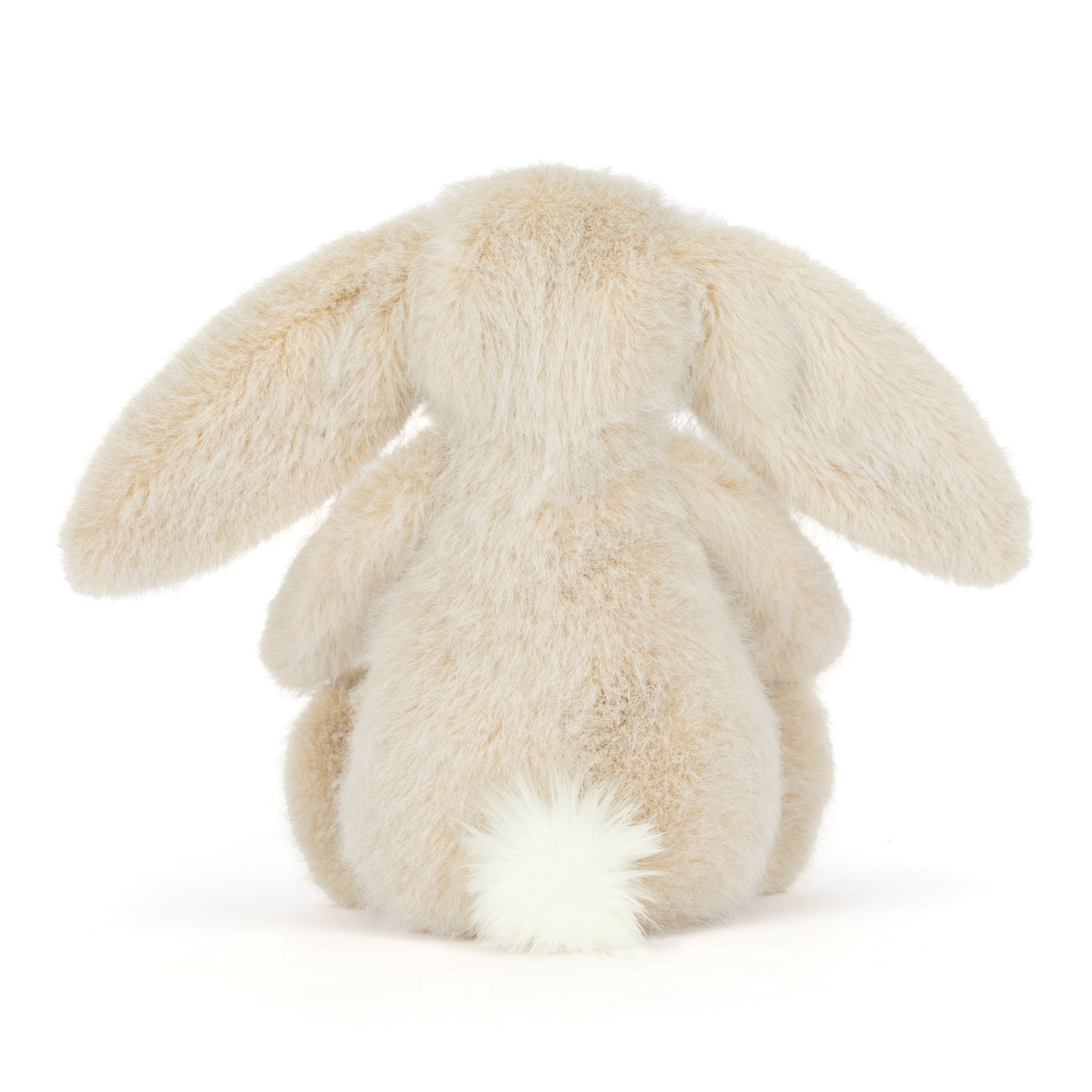 Fluffy beige bunny rabbit toy on a white background