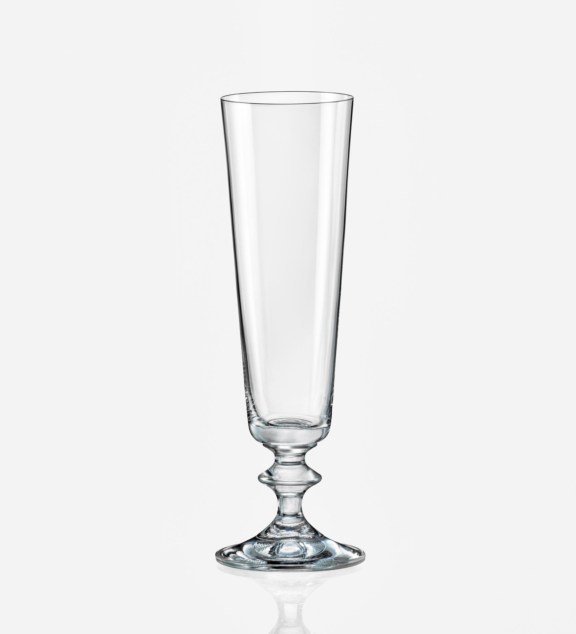 Clear glass with a pedestal base on a white background