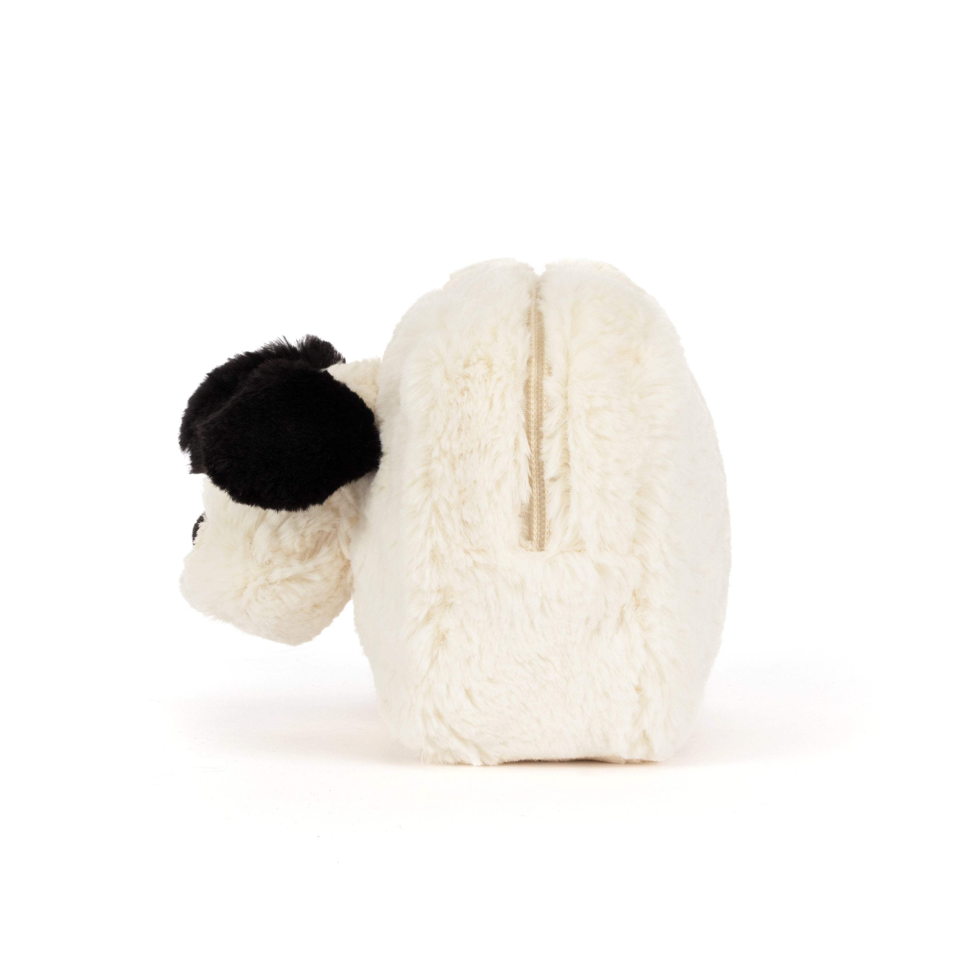 A plush zippered pouch in cream white faux fur with a black fluffy ear, shown from the side on a white background.
