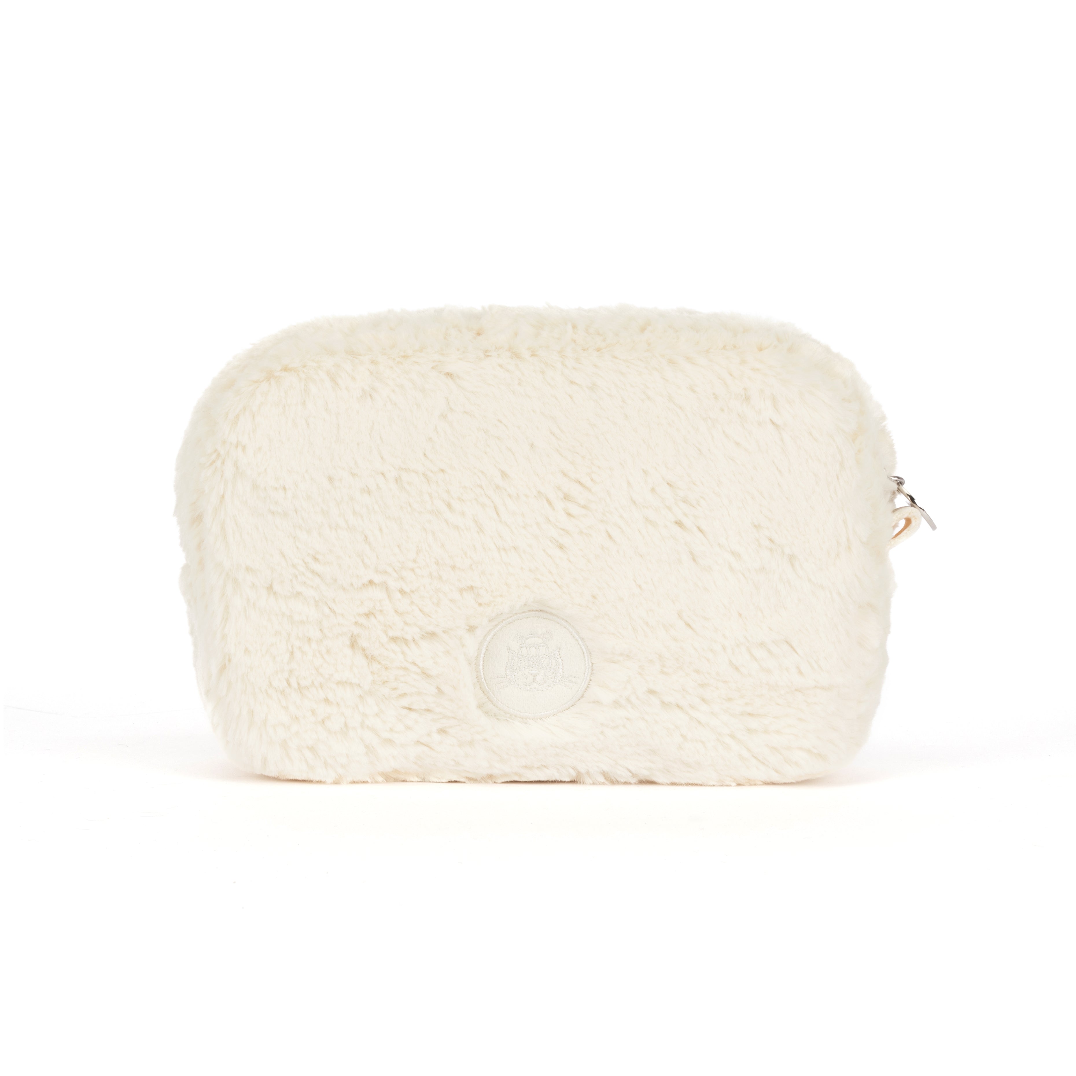 A cream-colored faux fur cosmetic pouch with a small silver zipper pull and a circular embossed logo on the back, set against a plain white background.