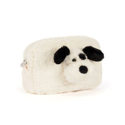 A white faux fur cosmetic pouch shaped like a dog's head, featuring black ears, nose, and eyes, on a solid white background.