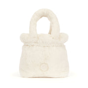 A shot of the back of a small cream plush faux-fur handbag with rounded top handles and a round logo on a white background
