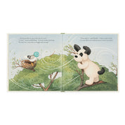 inside view of Book of 'The Pick of the Sticks' by jellycat with a puppy illustration on a white background