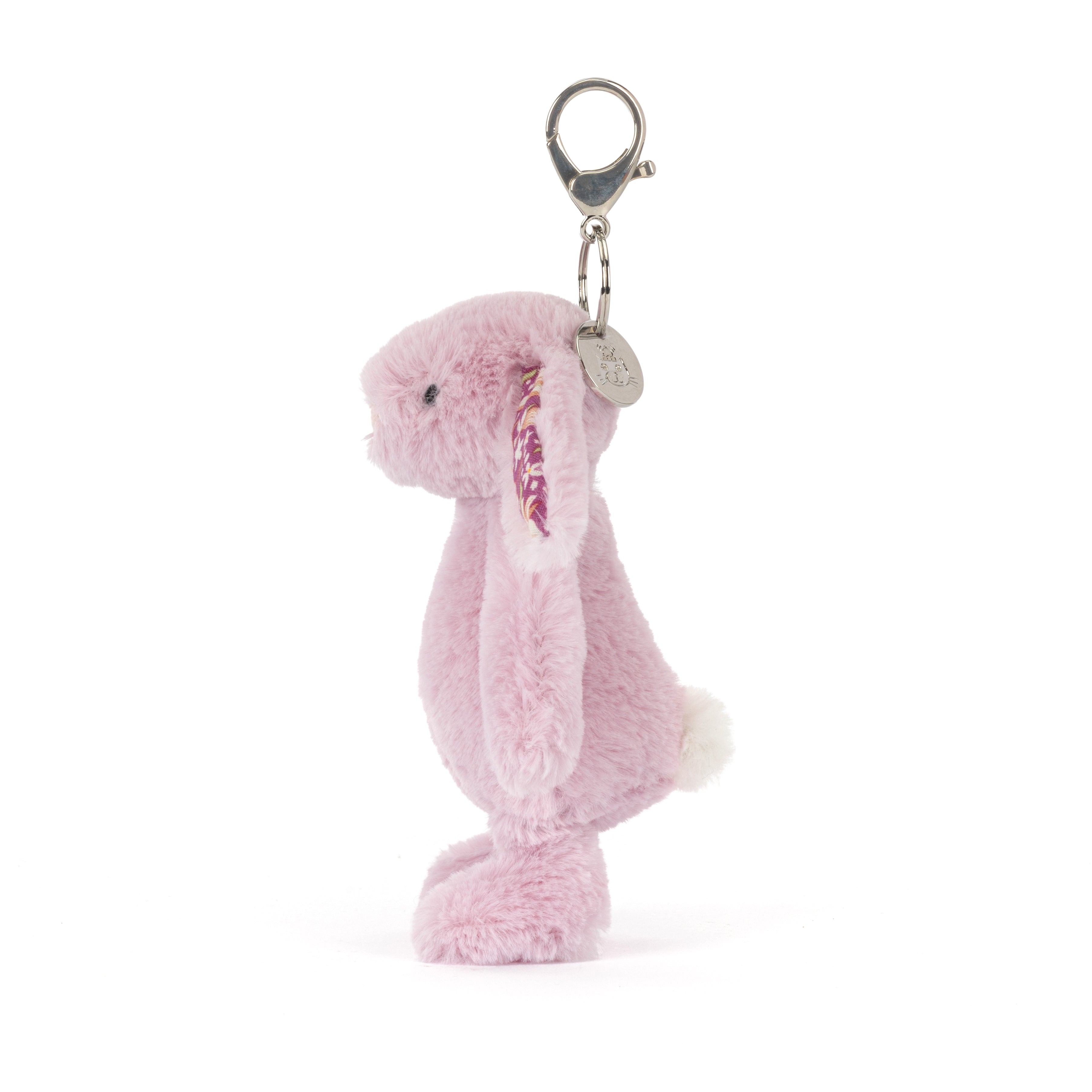 Pink plush bunny keychain on a white background