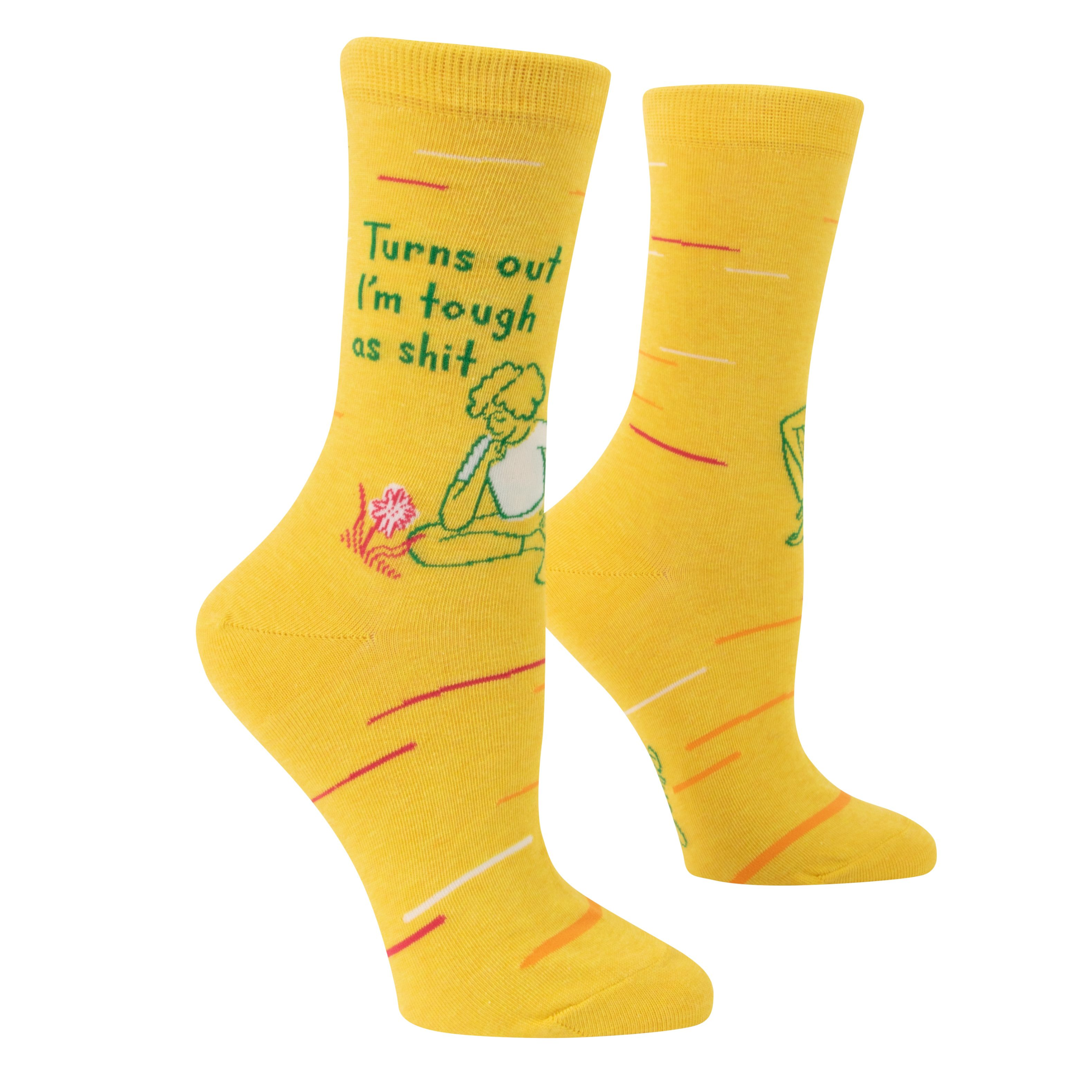 yellow socks with a picture of a person sitting beside a flower and above it says turns out i'm tough as shit