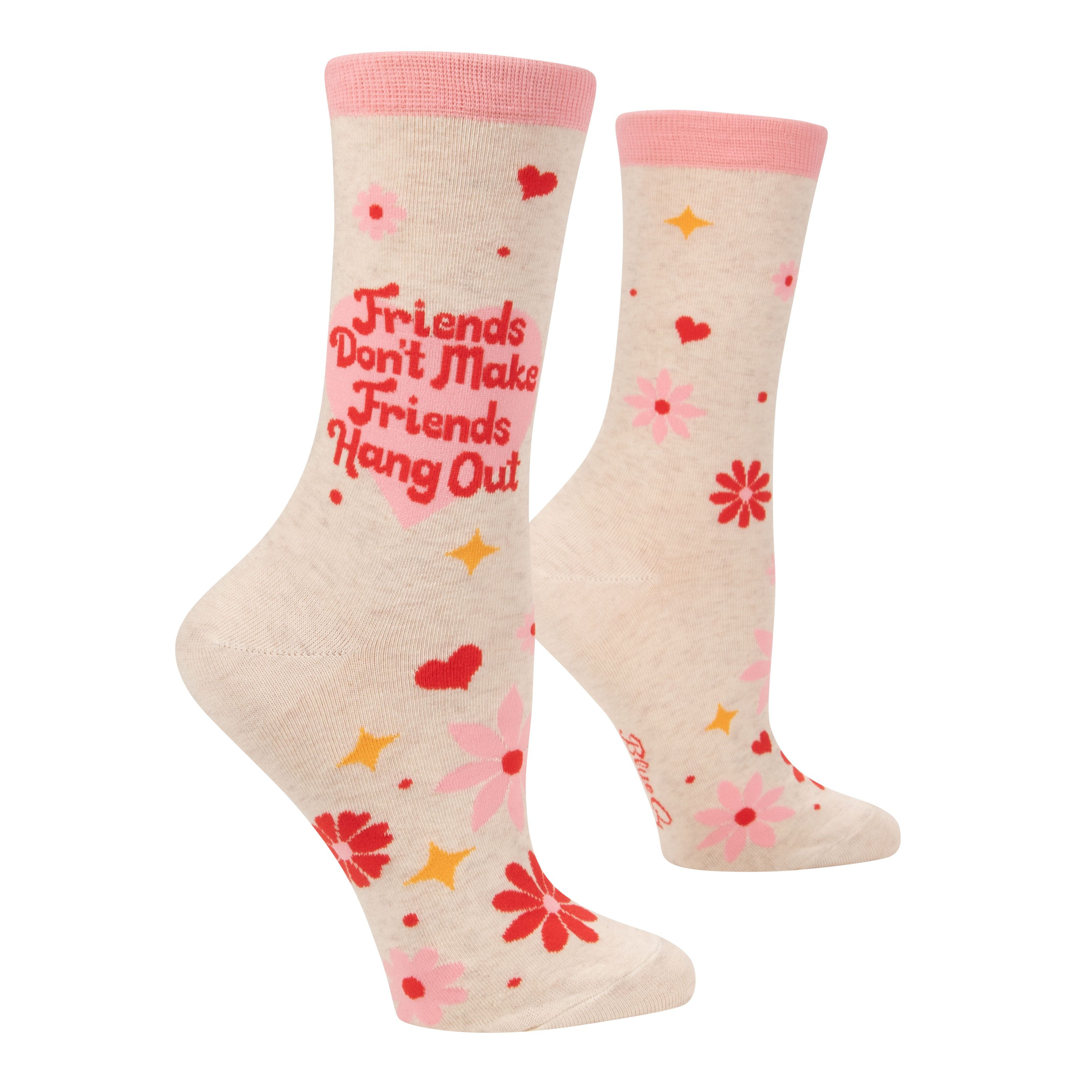 cream socks with pink red and yellow flowers stars and hearts on ankle in pink heart it says friends don't make friends hang out