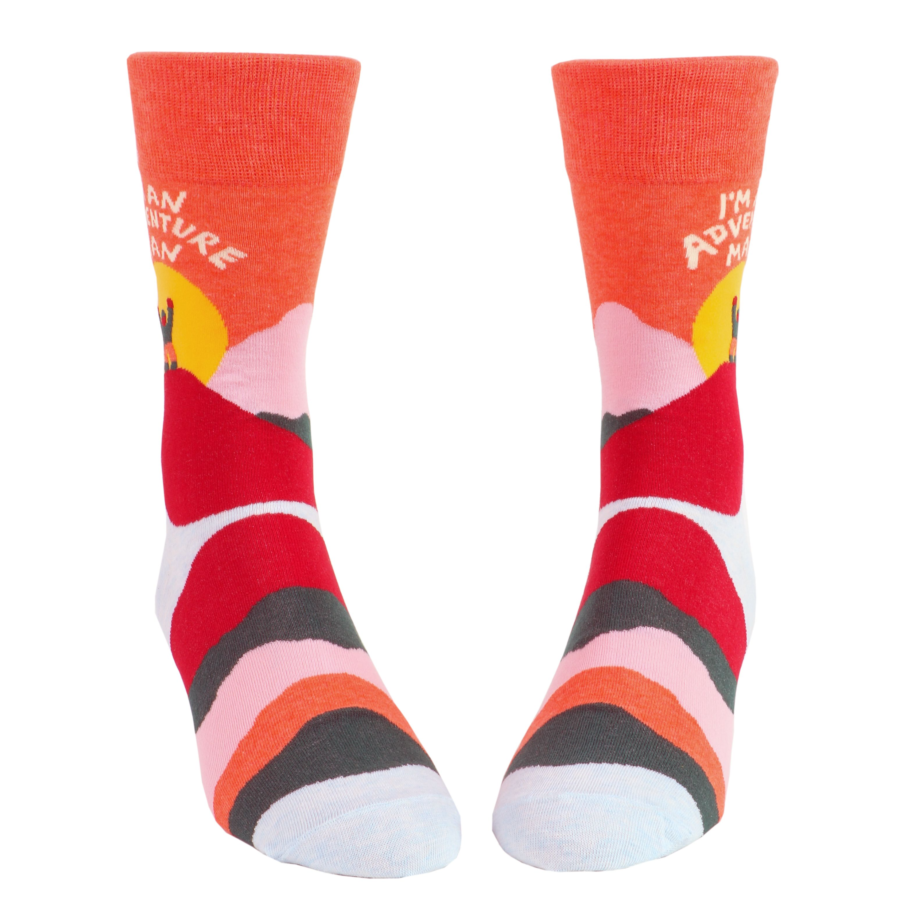 warm toned multicolour socks that show a sunrise with a person on top of hill with sun in behind 