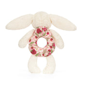 back view of Plush bunny baby rattle toy from jellycat with a floral ring on a white background