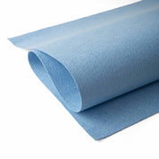 Roll of blue jude's cleaning cloth on a white background
