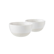 Two white ceramic bowls on a white background