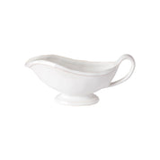 White ceramic gravy boat on a white background