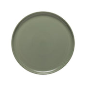 Green ceramic plate on a white background