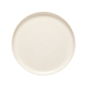 Round beige ceramic plate on a white background