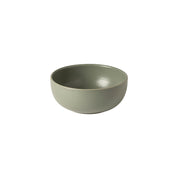 Green ceramic bowl on a white background