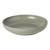 Green ceramic bowl on a white background