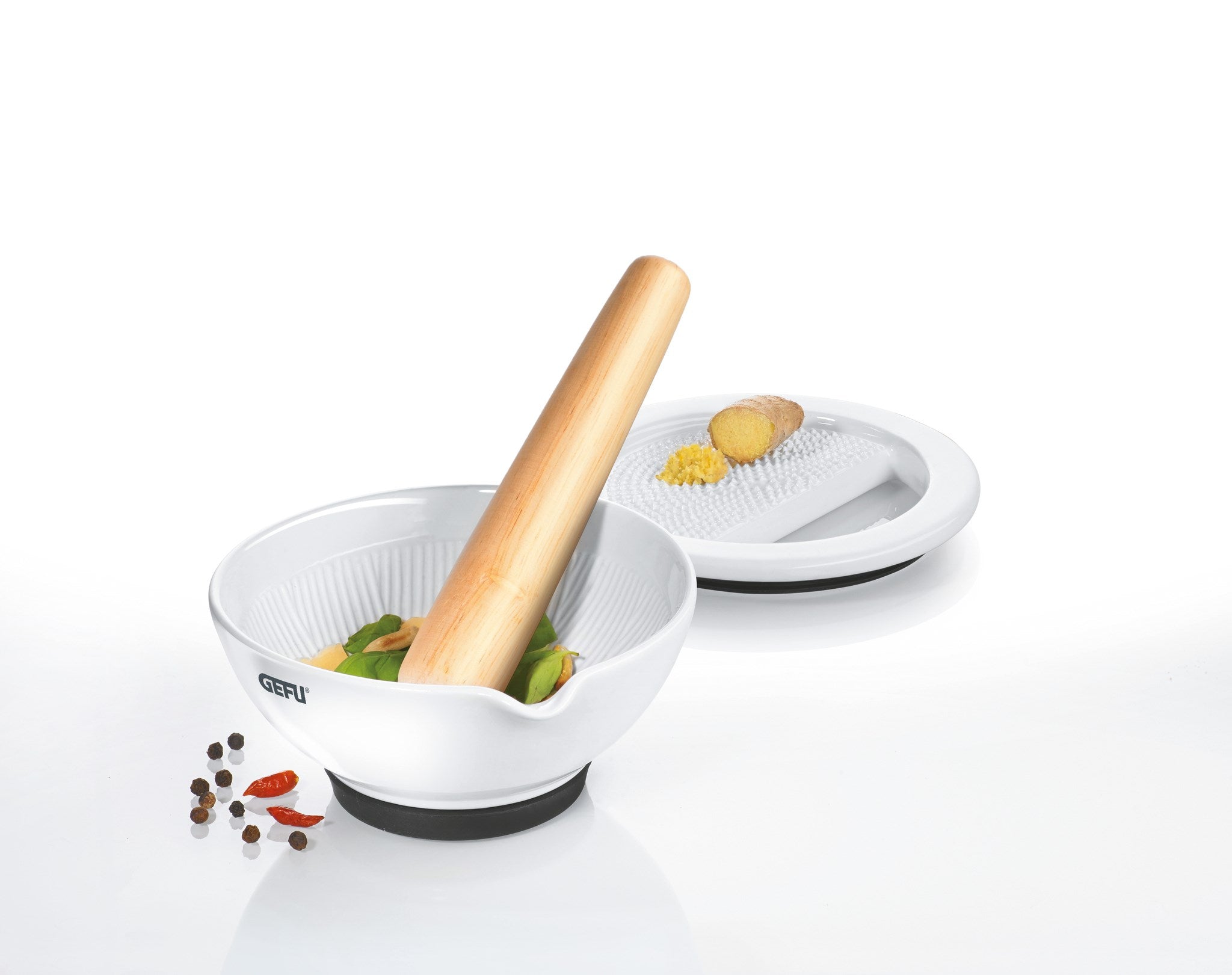 White kitchen tool with wooden handle on a white background