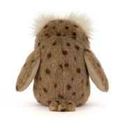 the back view of A brown jellycat owl plush toy with a fluffy white crest on its head, spotted brown wings, and pale yellow feet and beak, photographed on a clean white background.